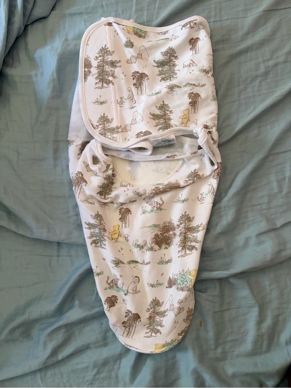 Winnie the Pooh swaddles and a couple of newborn outfits :)